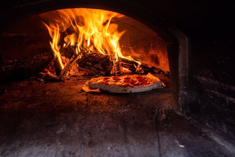 Italian pizza in wood-fired oven