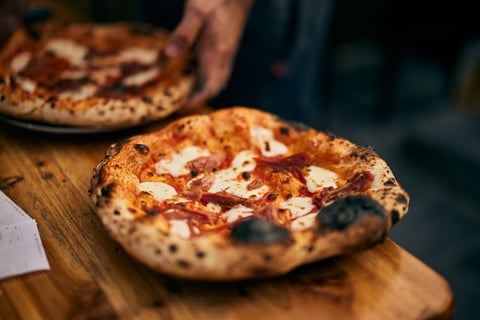 Delicious pizza with melting cheese
